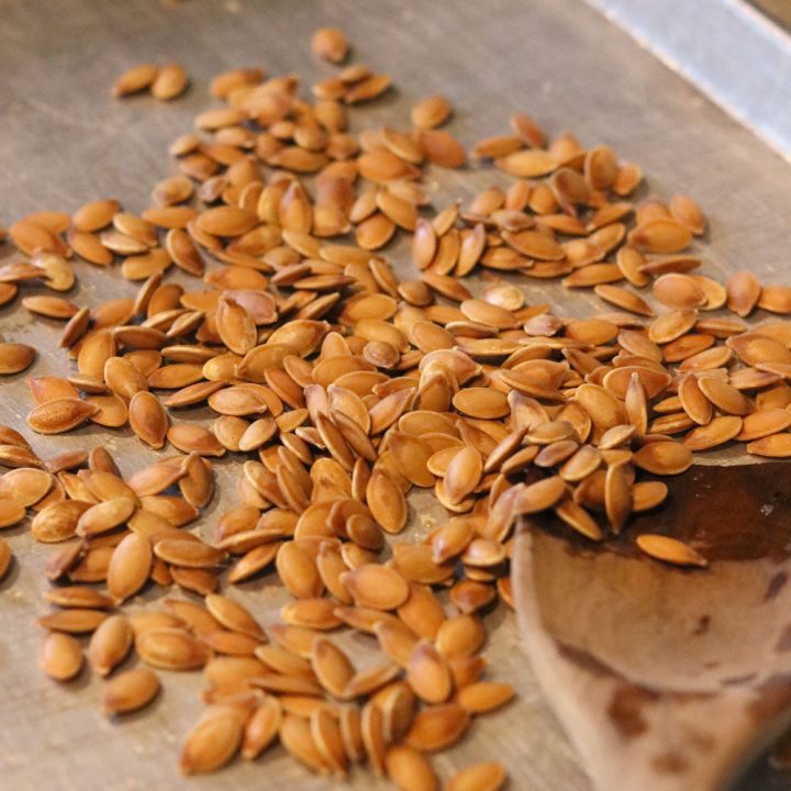 roasted pumpkin seeds on a baking sheet